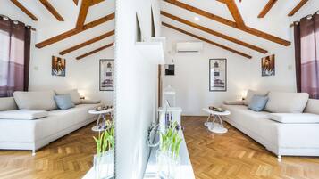 Superior Apartment | Living area | 86-cm LED TV with satellite channels, TV