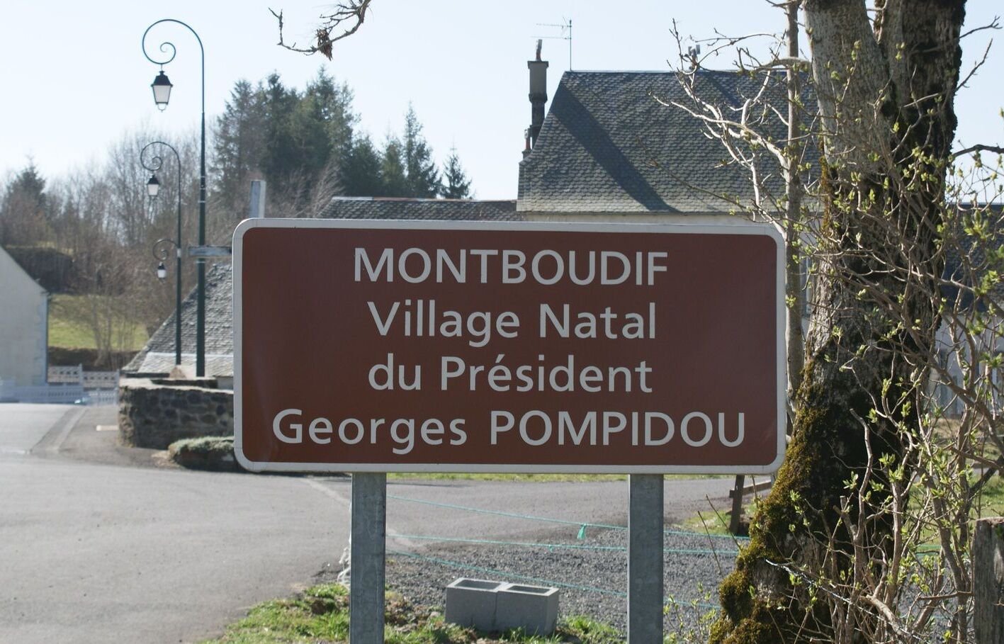 A sign for Montboudif Village Natal du President Georges Pompidou.