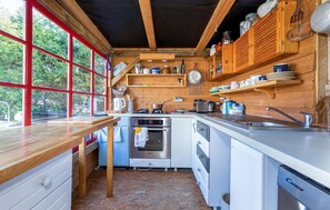 Fridge, stovetop, dishwasher, coffee/tea maker