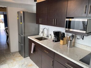 Fridge, microwave, stovetop, coffee/tea maker