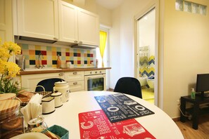 Fridge, oven, coffee/tea maker, cookware/dishes/utensils