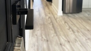 A modern kitchen with a stainless steel refrigerator and a wooden floor. - Victorian architecture dipped in refined modernity. May-June-July special!!! (Portland)
