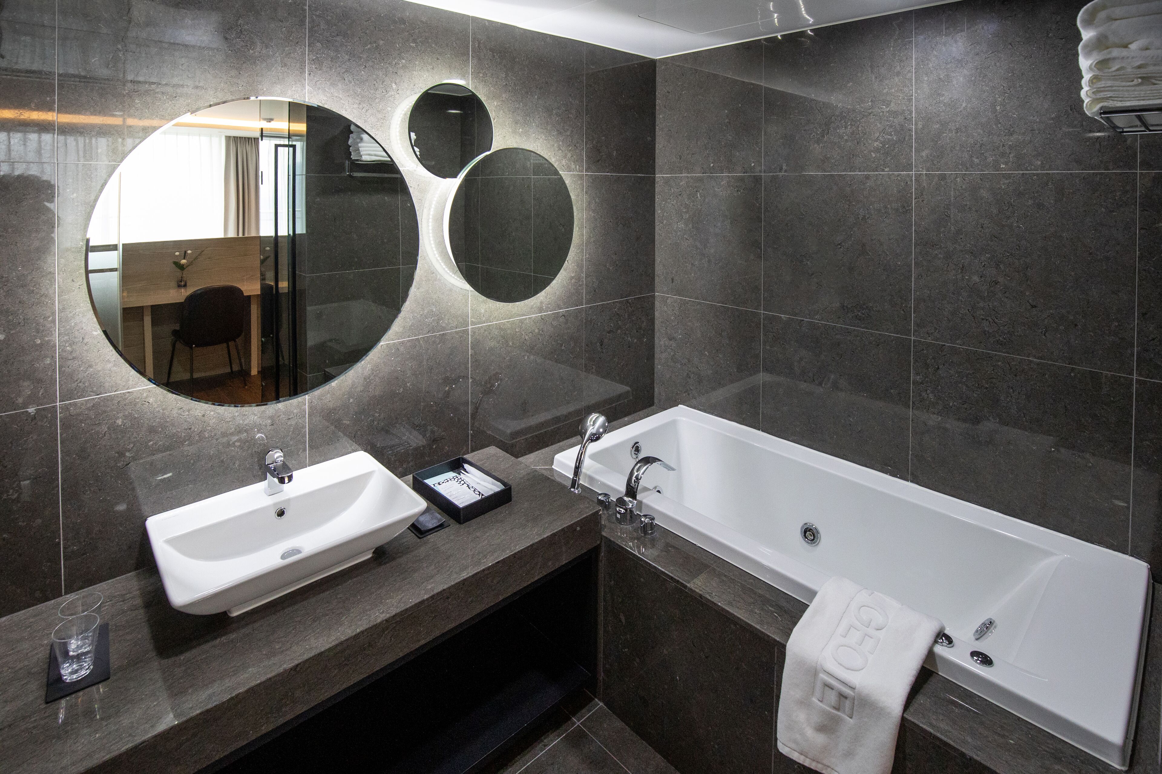loft executive suite | bathroom | deep-soaking bathtub, hair dryer, slippers, bidet