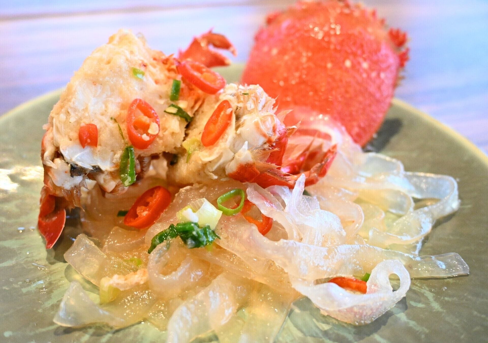 A dish with seafood and translucent noodles on a plate.