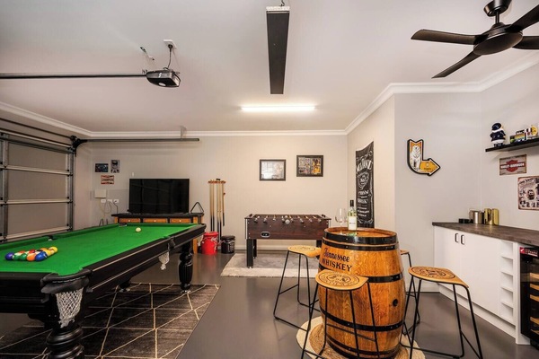 The garage has been converted into a fully-equipped game room.