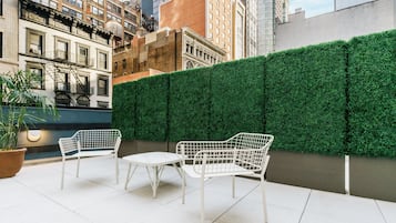 Studio, 1 King Bed, Kitchenette, Courtyard View | In-room safe, desk, laptop workspace, iron/ironing board