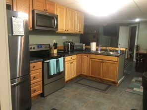 Microwave, coffee/tea maker, cookware/dishes/utensils, paper towels