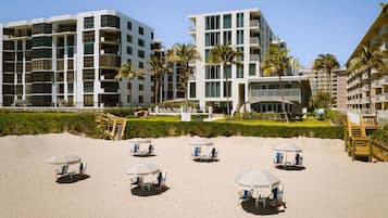 On the beach, sun loungers, beach umbrellas, beach towels