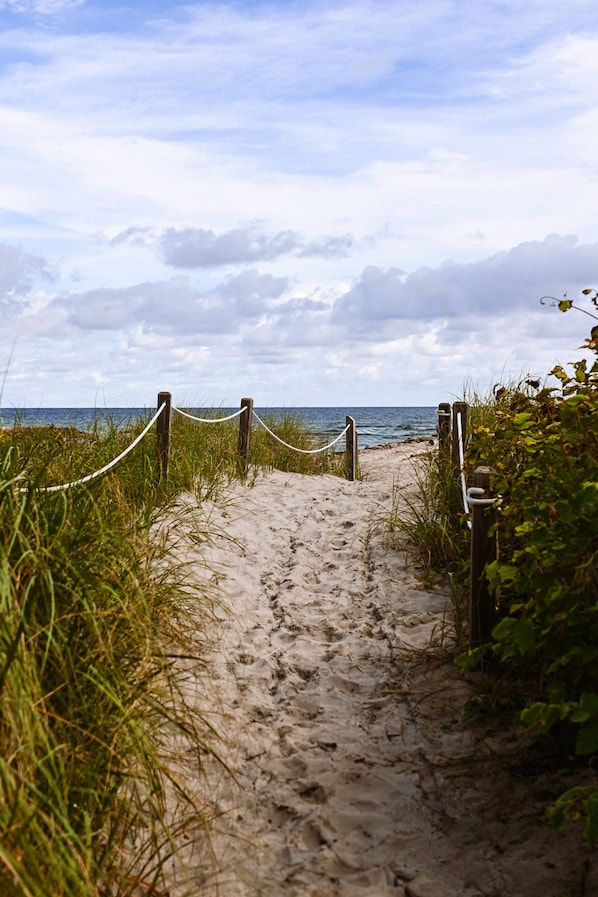 On the beach, sun-loungers, beach umbrellas, beach towels