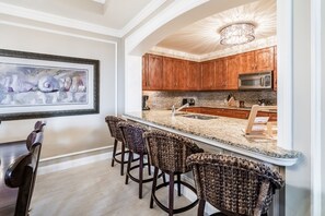Fridge, microwave, oven, stovetop - Beautiful Family Friendly Condo located at The Ritz-Carlton in Cayman (Seven Mile Beach)
