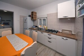 Fridge, stovetop, cookware/dishes/utensils