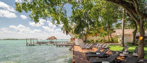 On the beach, sun-loungers