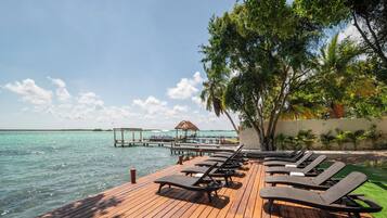 On the beach, sun-loungers