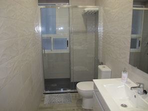 Shower, hair dryer, towels, soap