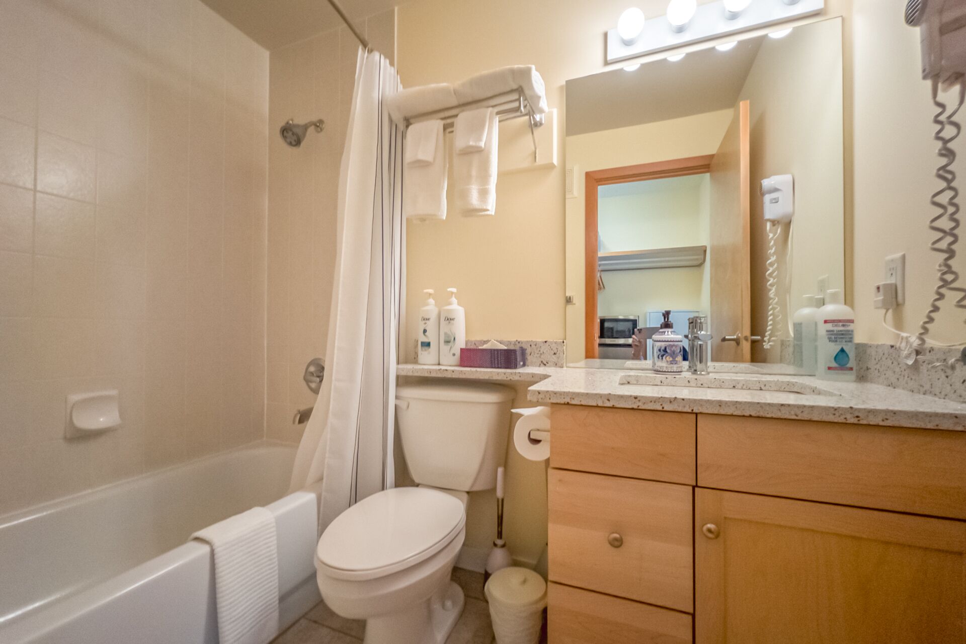Combined shower/bathtub, hair dryer, towels, soap