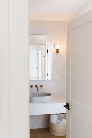 Designer toiletries, hair dryer, bathrobes, towels