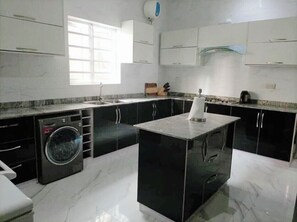 Microwave, cookware/dishes/utensils, dining tables