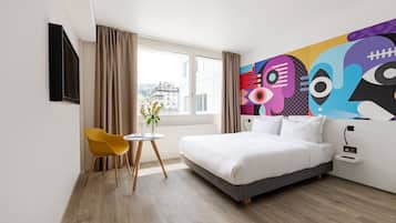 Premium bedding, laptop workspace, blackout curtains, soundproofing