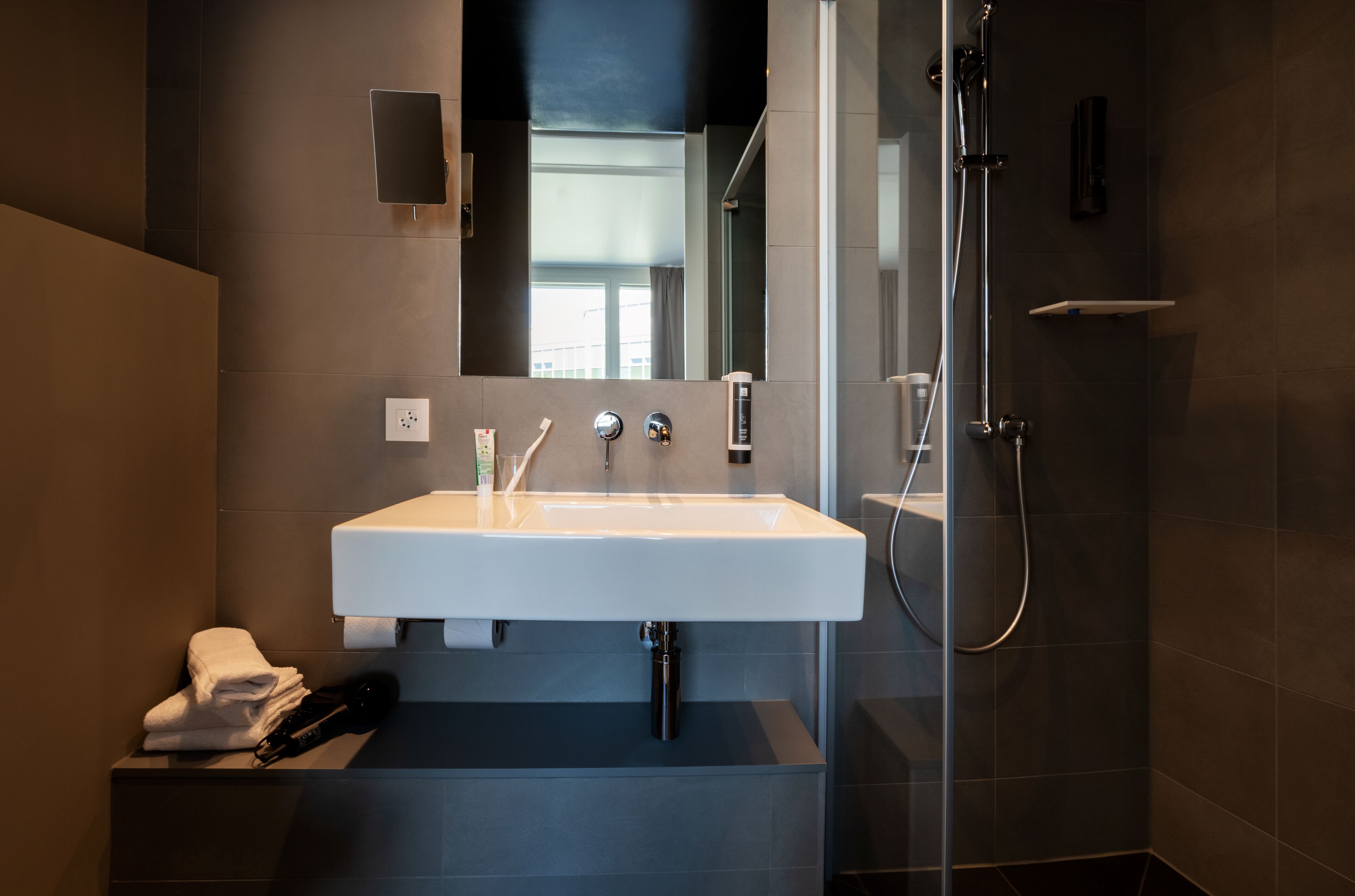 shower, rainfall showerhead, hair dryer, towels