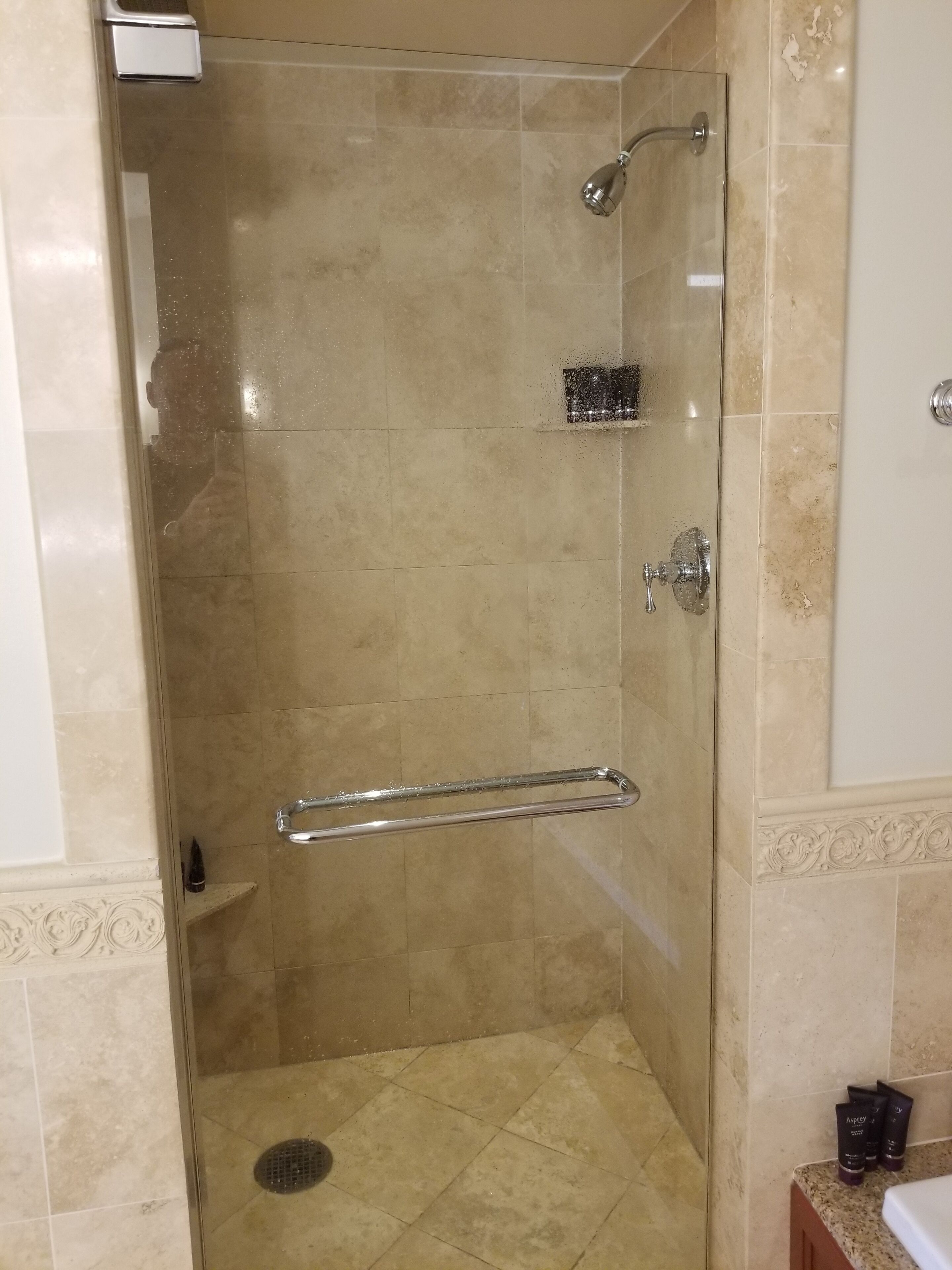 bathtub, hair dryer, towels, soap