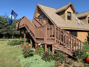 A wooden house with a wooden staircase leading to a deck. - Perfect Grand Marais Get-Away! Pictured Rocks, snowmobile trails, beaches, etc (Grand Marais)