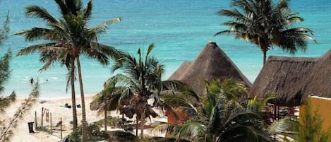 On the beach, sun loungers, beach towels