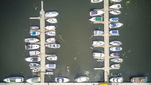 A marina with boats docked in a symmetrical layout.
