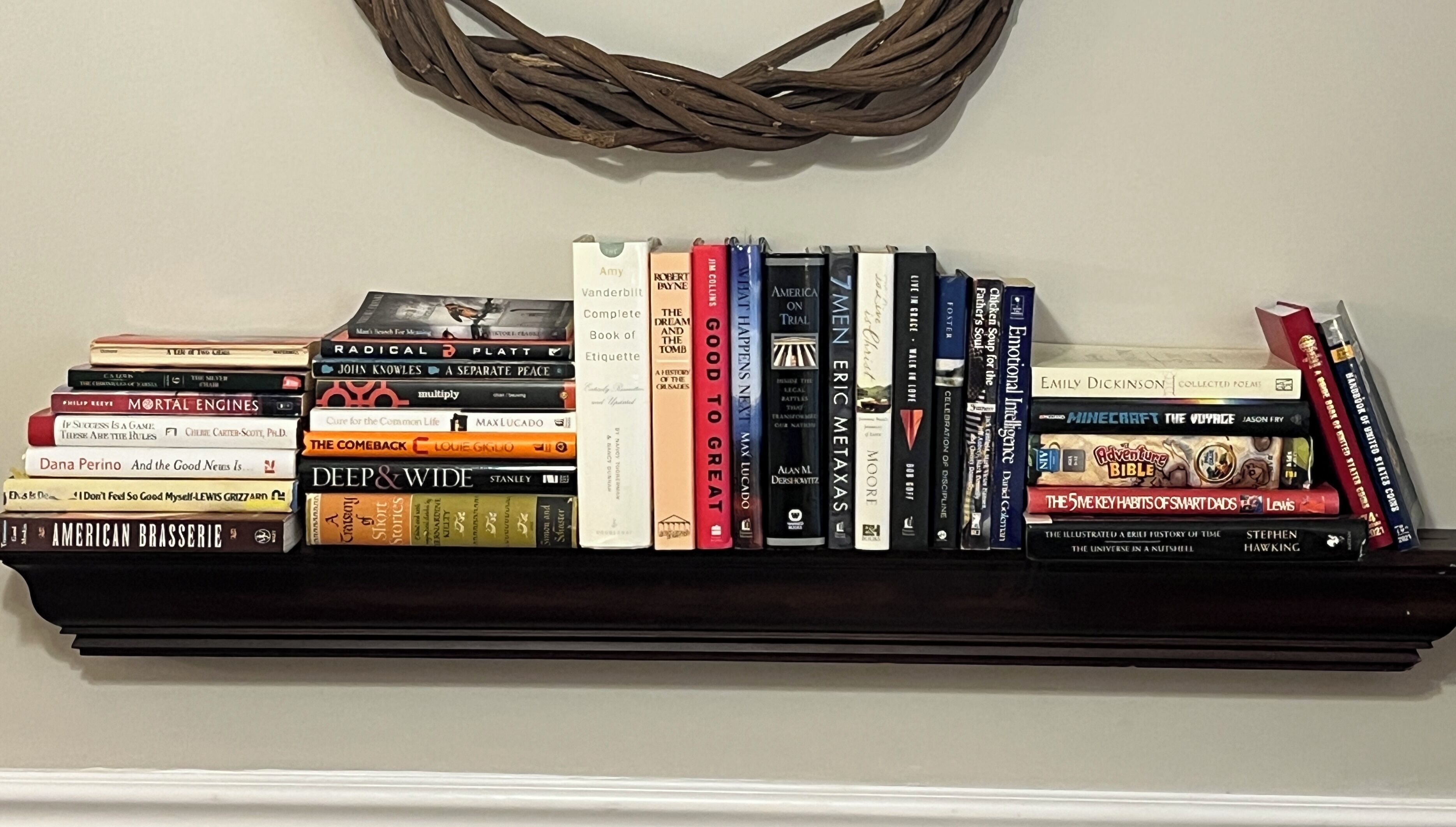A bookshelf with a variety of books.
