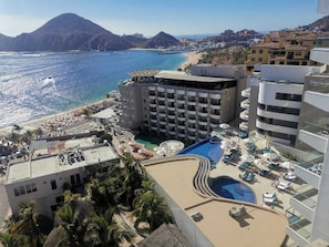 Relax by the rooftop pool overlooking the coastline and surrounding mountains.