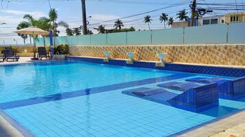 Outdoor pool, open 9:00 AM to 9:00 PM, pool umbrellas, pool loungers