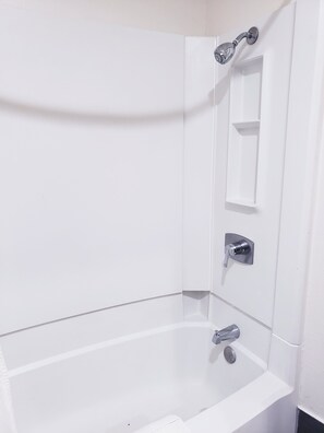 Combined shower/bathtub, towels, soap, shampoo