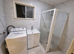 Shower, hair dryer, towels, soap