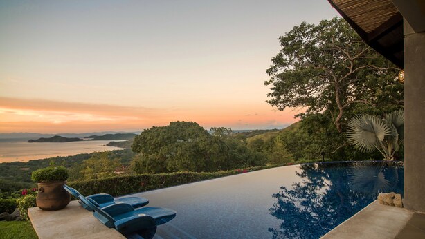 A infinity pool with a view of the sea and hills. - Villa Costa Mar Ocean View Guard Gated Community (Playa Hermosa, Carrillo)