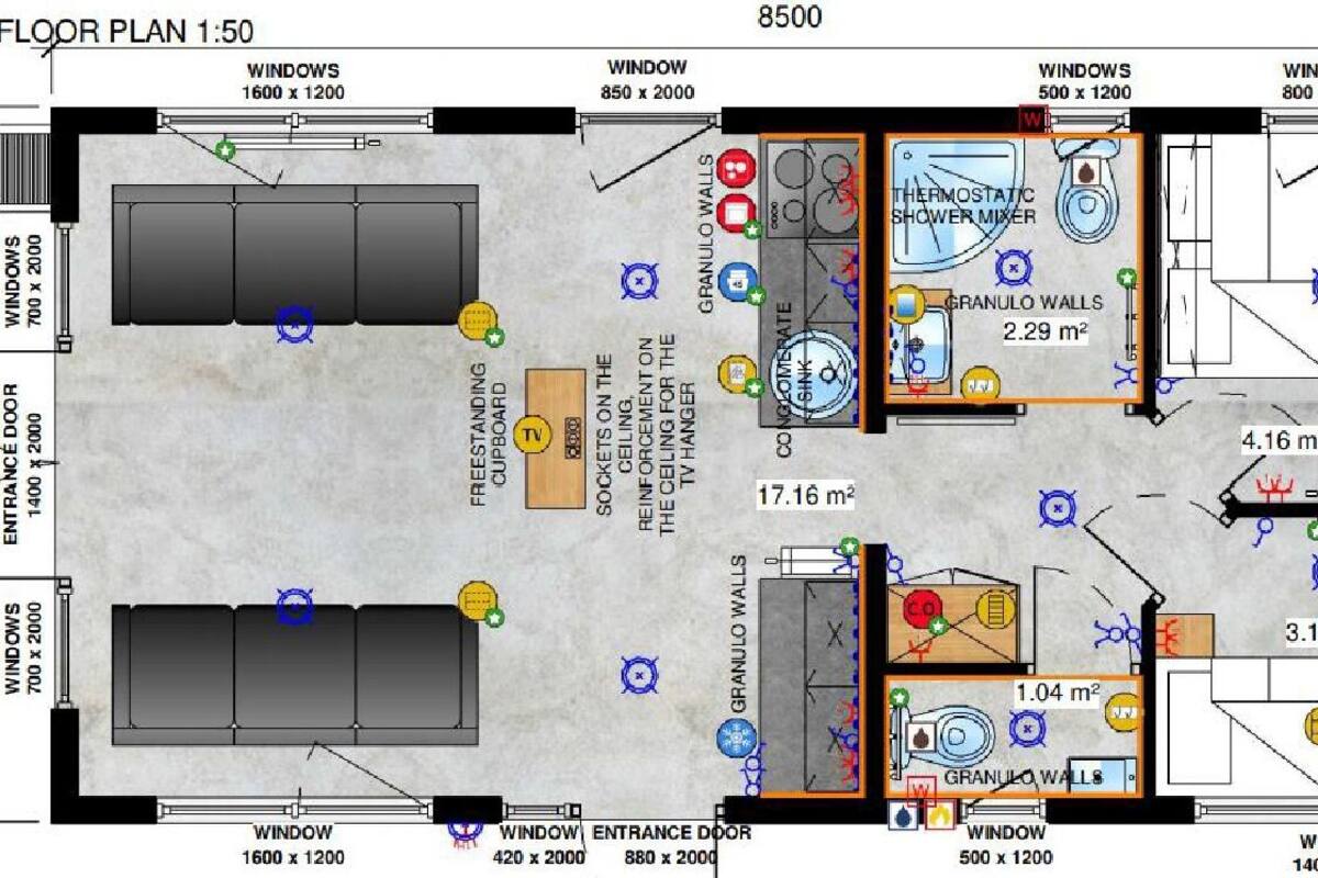 Plano de planta que muestra una sala de estar, un baño y una kitchenette.