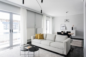 Business Apartment | Living room | 43-inch Smart TV with digital channels, TV, Netflix - Spacious & Airy 1 Bedroom Apartment near HELEXPO (Marousi)