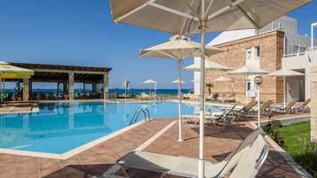 Seasonal outdoor pool, pool umbrellas, sun loungers