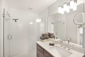 Combined shower/tub, hair dryer, towels, soap