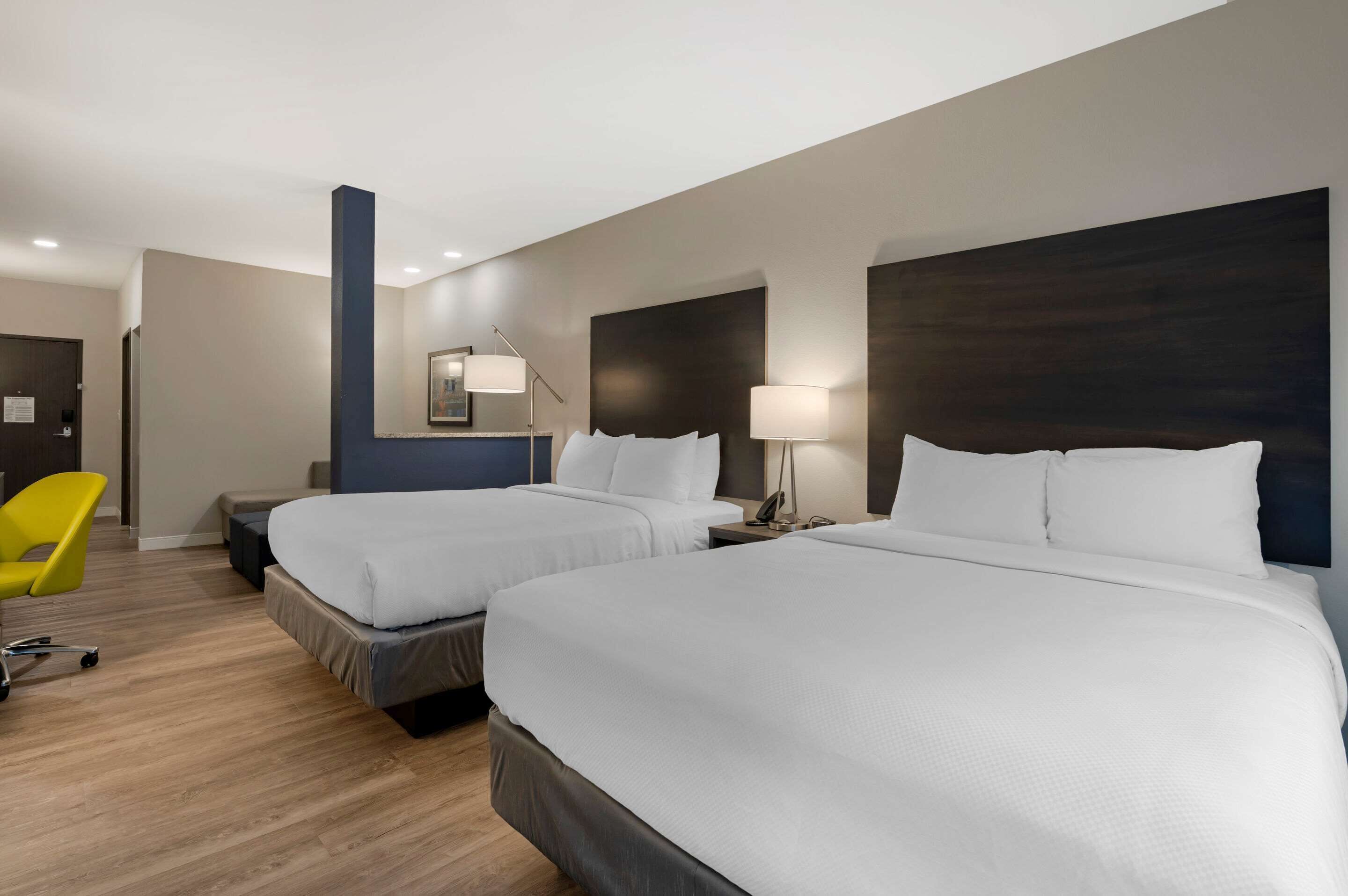 standard room, 2 queen beds, non smoking | premium bedding, desk, iron/ironing board, cots/infant beds