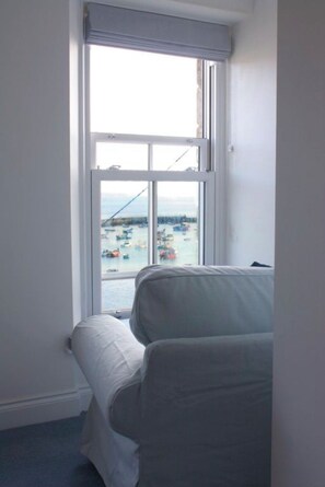 Enjoy a harbor view from the comfort of your room, with a large window offering a glimpse of boats below.