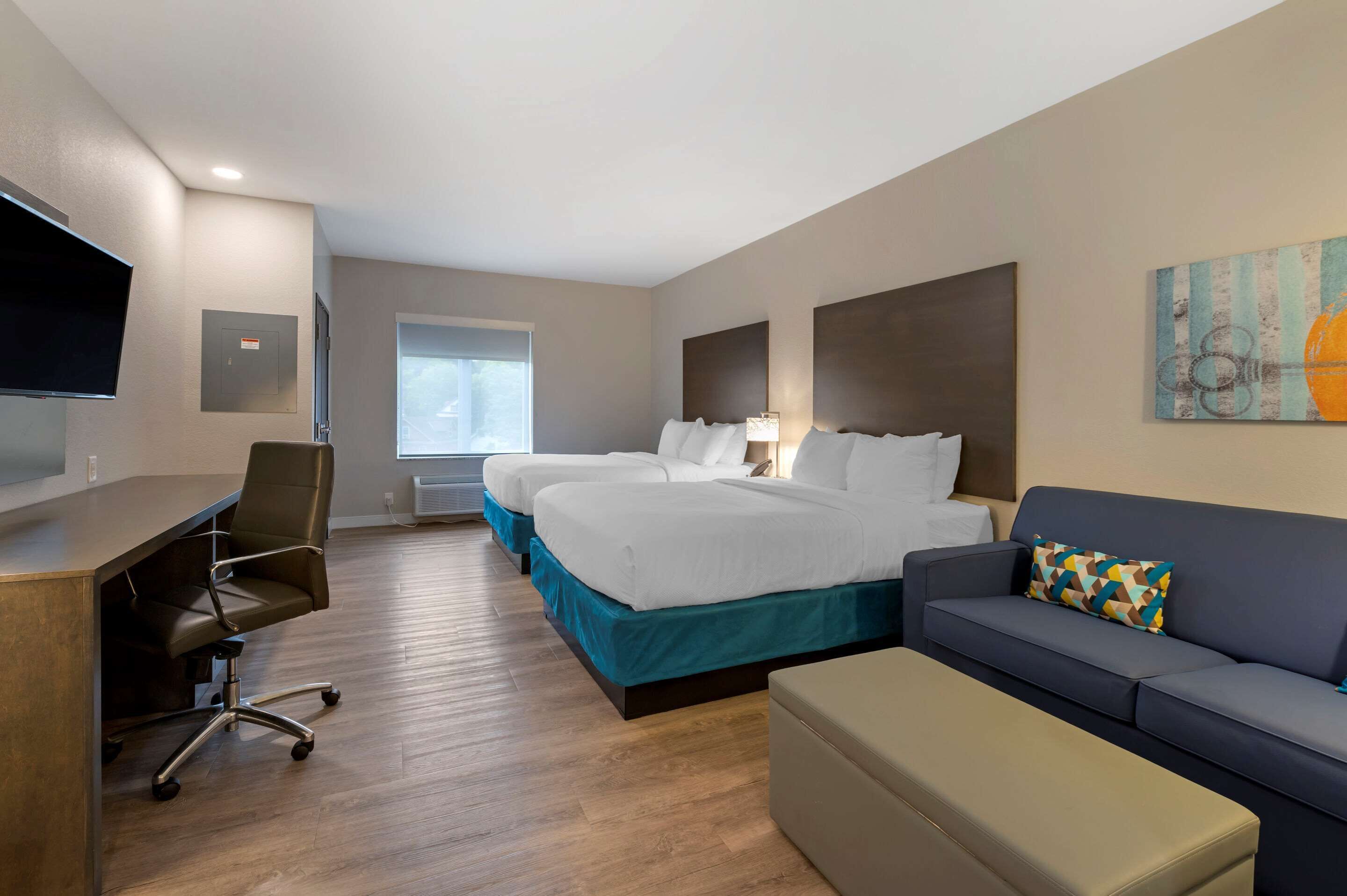 desk, laptop workspace, blackout curtains, iron/ironing board