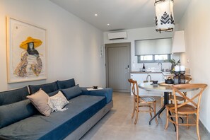 Deluxe Suite, Jetted Tub, Sea View | Living area | 35-inch LCD TV with satellite channels, TV, Netflix - Pignolia Suites - Adults Only (Ierapetra)