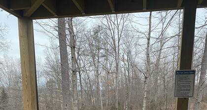 Relax in our secluded hot tub overlooking the pond with a glass of wine in Luray