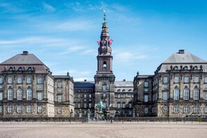A historic building with a prominent tower and two large domed structures. - 175sqm High-end Luxury Apartment - Heart of CPH (Copenhagen)