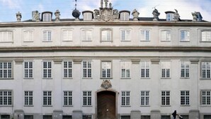 A large, historic building with a symmetrical facade, multiple windows, and a central entrance. - 175sqm High-end Luxury Apartment - Heart of CPH (Copenhagen)
