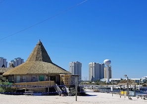 Enjoy stunning ocean views from the deck of this beach hut, offering access to the boardwalk and nearby landmark, Navarre Beach.