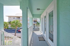 Enjoy the view of the surrounding cityscape from this balcony with a street view.