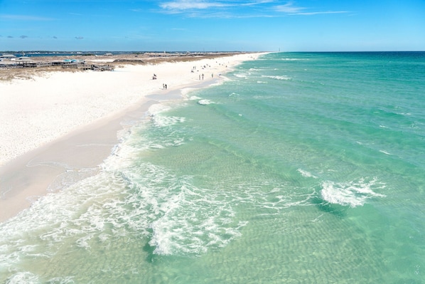 Enjoy a serene beach experience with access to turquoise waters and a sandy shore.