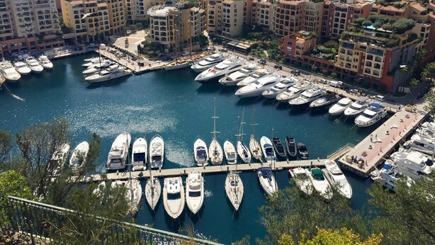A marina with numerous yachts docked, surrounded by residential buildings and a view of the sea. - Provençal Villa with Large Pool • 9000 m² of Nature • Total Privacy (Draguignan)