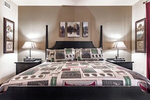 A bedroom with a large bed, two bedside tables, a headboard, and three wall-mounted paintings. - Great Location! 2br/2ba Beautiful Views Indoor/Outdoor Pools, Game Room 3003 (Pigeon Forge)