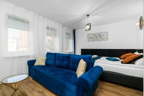 Basic Quadruple Room, 1 Bedroom, Non Smoking, Ensuite | Living area | Flat-screen TV - Sleepway Apartments - Modern Dream (Poznan)